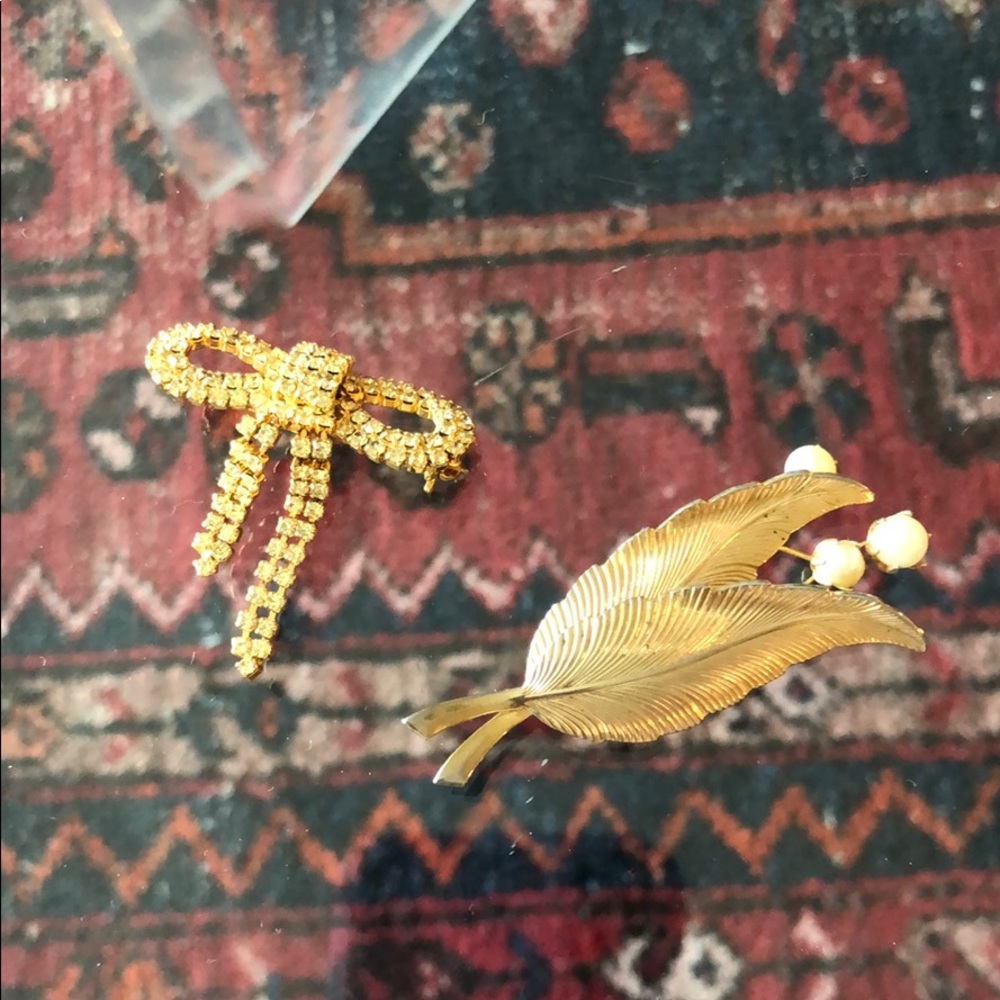 Two gold brooches